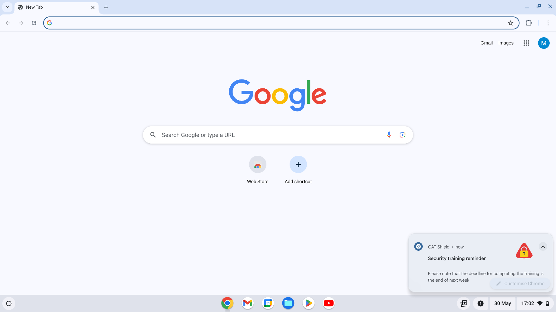 Chrome browser showing a GAT Shield notification in the lower-right corner with a 'Security training reminder' message, triggered as a pop-up 