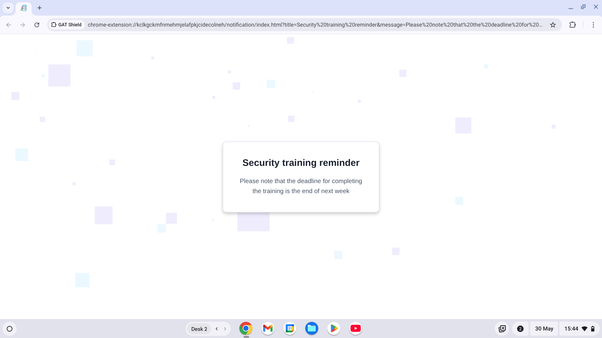 Full-screen notification in Chrome browser from GAT Shield displaying a 'Security training reminder' message about completing training by the end of next week, shown as a new tab with no user interaction required